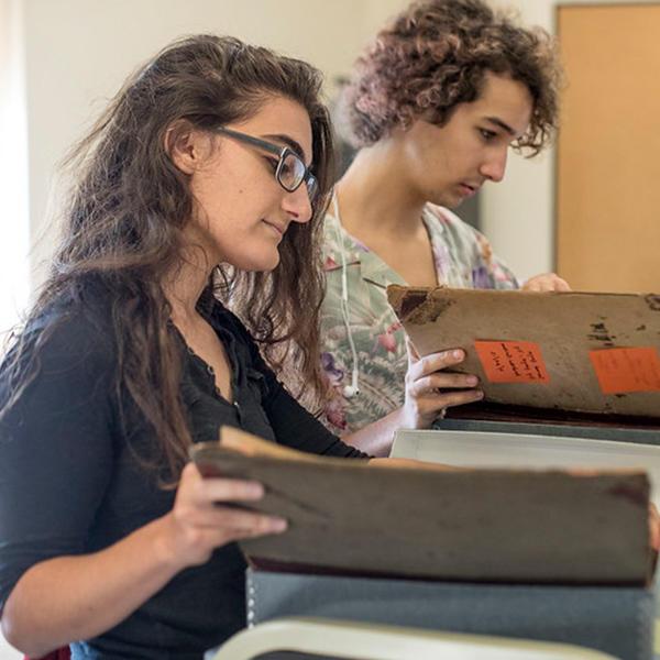 two students look at manuscrips